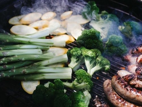 grilling vegetables over a smoker grill