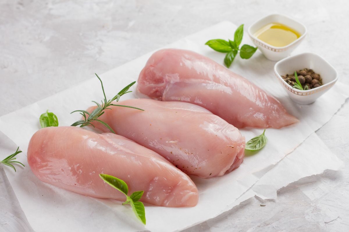 Raw Chicken Breasts with Olive Oil and Peppercorns