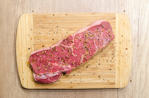 raw meat on a chopping board