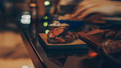 Cooked Meat On Brown Wooden Table
