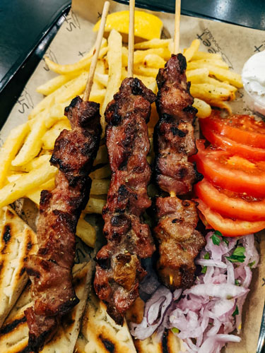 Kebab with Sliced Tomatoes and Green Vegetables