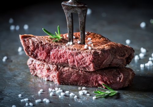 Medium rare steak with salt
