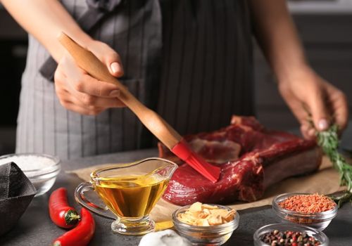Applying Oil onto Raw Steak