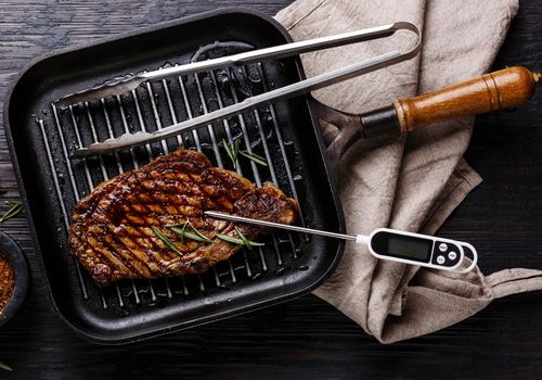 Grilled Steak on Pan and Meat Thermometer
