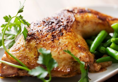 Roast Chicken Leg Cooked With Rosemary and Served With Green Beans