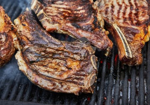 Grilled Beef Steaks with Grill Smoke