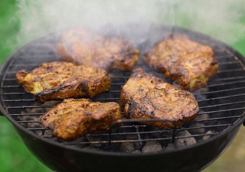 Meat Grilling on a Portable BBQ Outdoor Grill