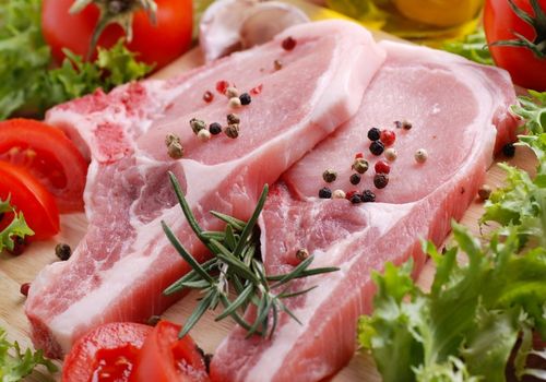 Raw Pork Chops with Tomatoes and Spices