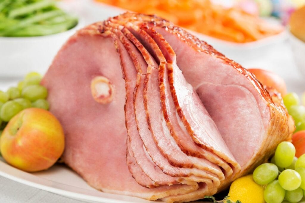 A Spiral Cut Ham with Grapes and Apples