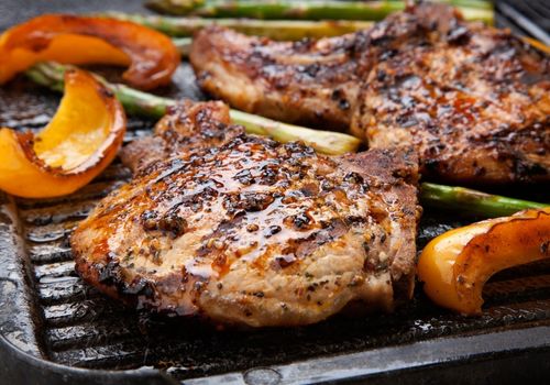 Juicy Pork Chops Grilled with Asparagus and Bell Peppers