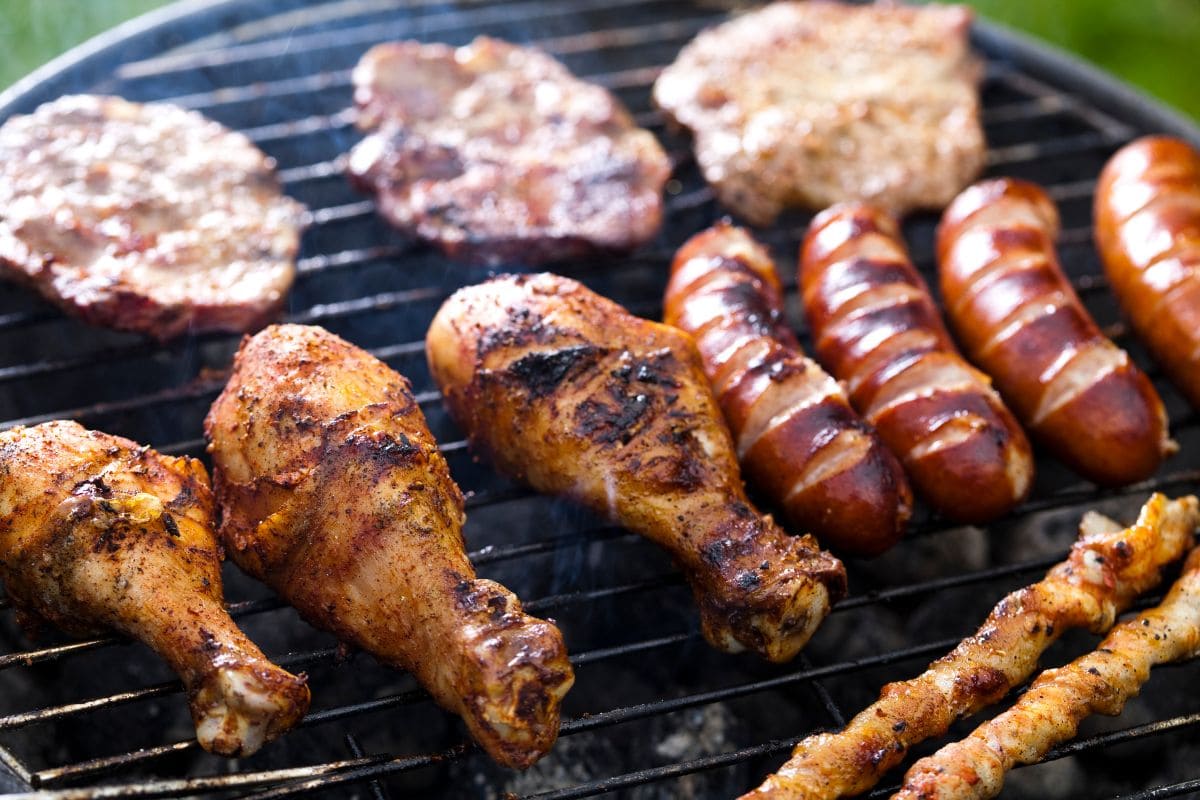 Chicken Drumsticks and Sausages on the Hot Grill