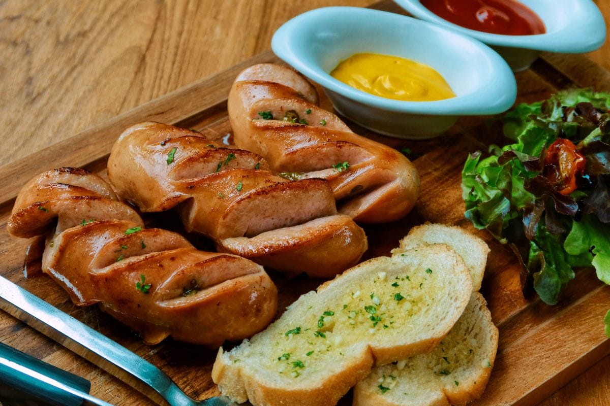 Toasted Bread with Grilled Sausages and Mustard Sauce Plus Tomato Sauce