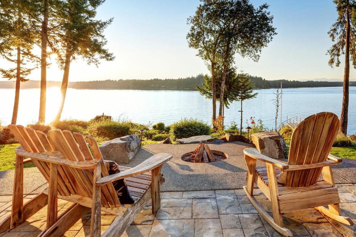 Waterfront House with Adirondack Chairs with Fire Pit