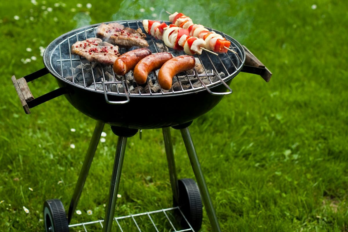 Hot Outdoor Grilling Using Portable Charcoal Grill