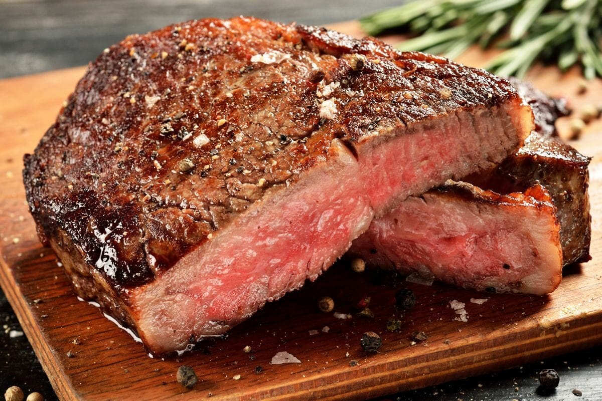Medium Rare Ribeye Steak on the Wooden Board