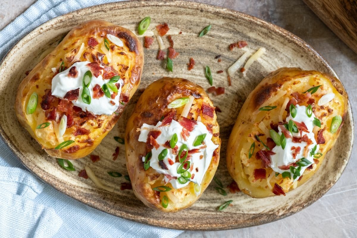 Smoked Baked Potatoes with Cheese, Sour Cream and Onions