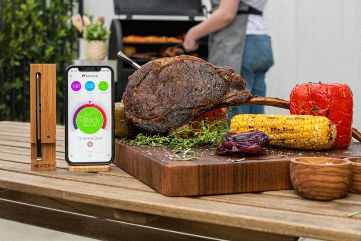Smoked Meat and Veggies Along with Meat Thermometer on the Wooden Table