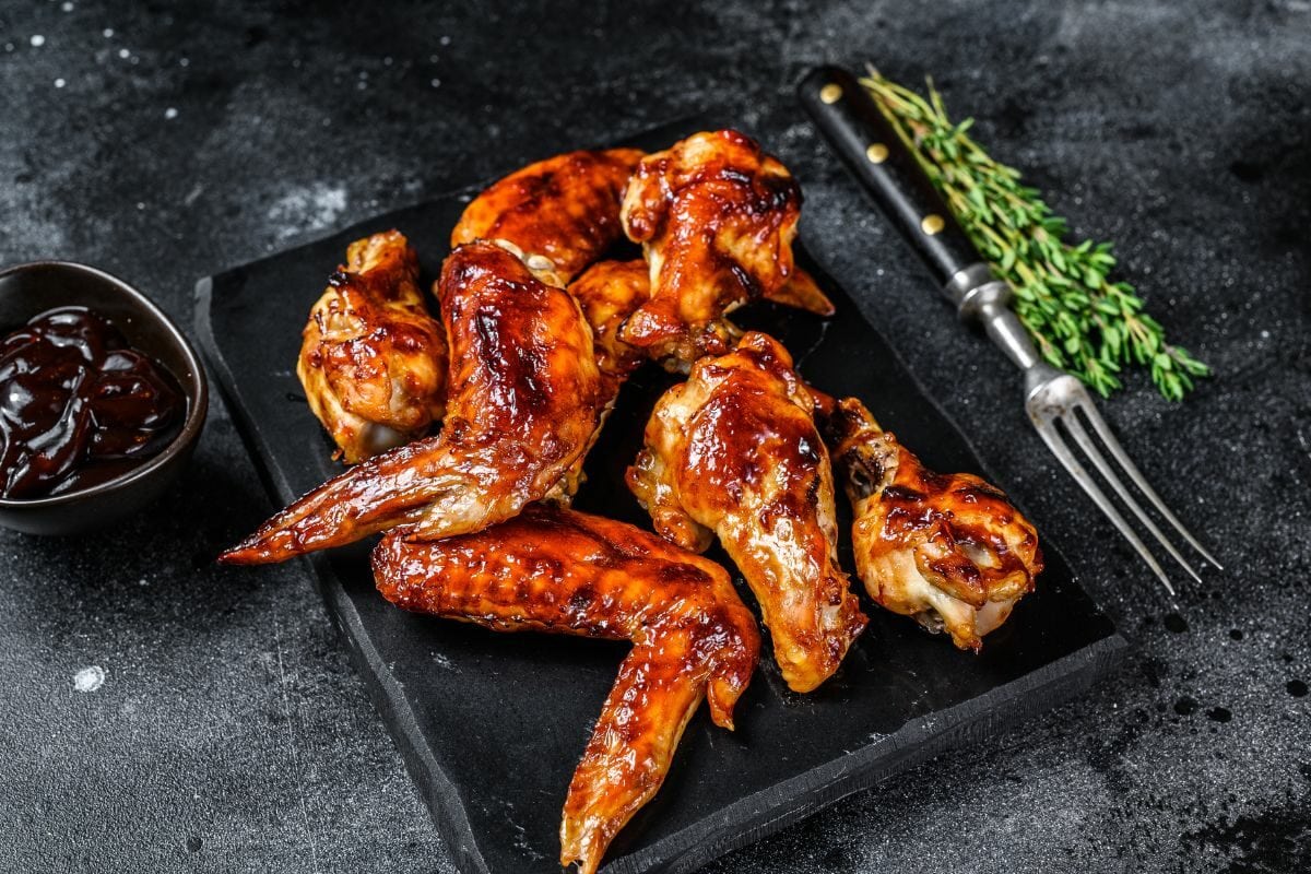 Spicy BBQ Chicken Wings with Sauce and Herbs