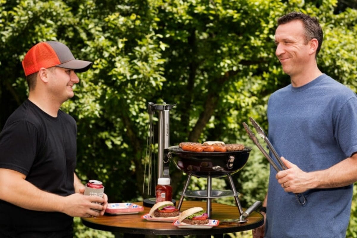 Two Men Enjoying Barbecue Party with Cuisinart Portable Grill