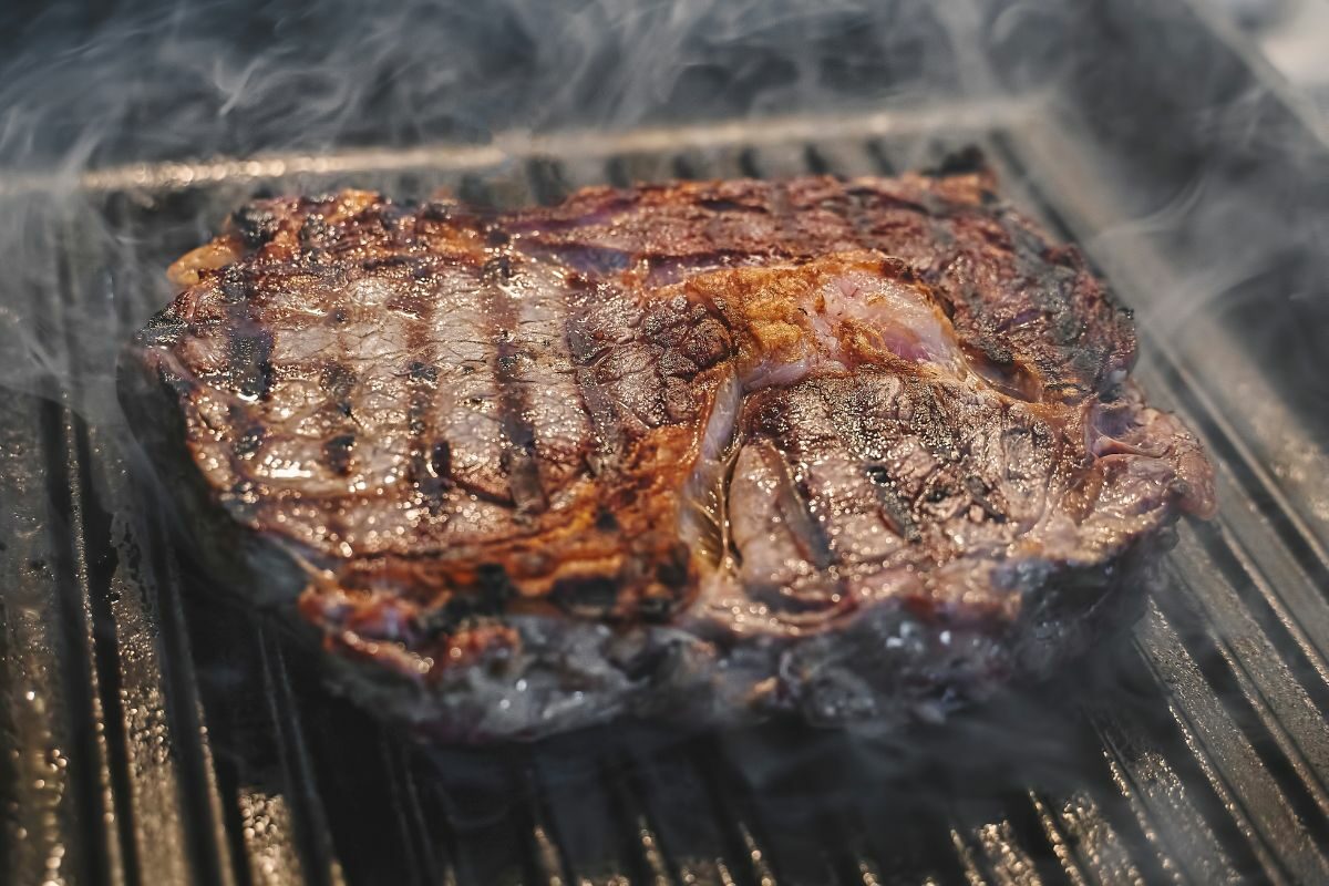 Juicy Steak Cooking on a Griddle