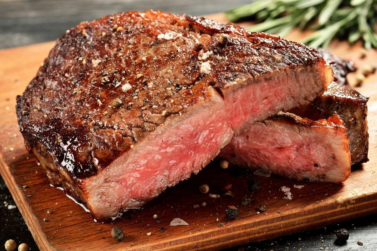 Medium Rare Ribeye Steak on the Wooden Board