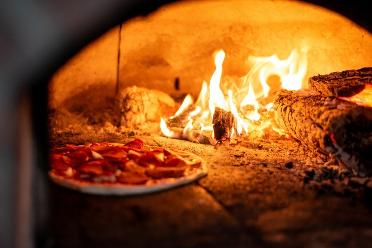 Pizza Cooked in a Wood Fire Oven