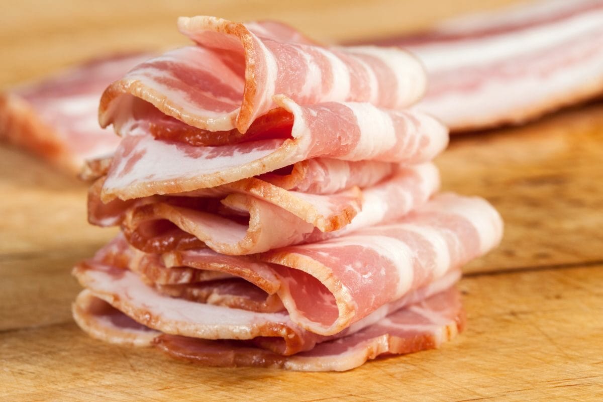 Slices of Raw Bacon Stacked in a Pile