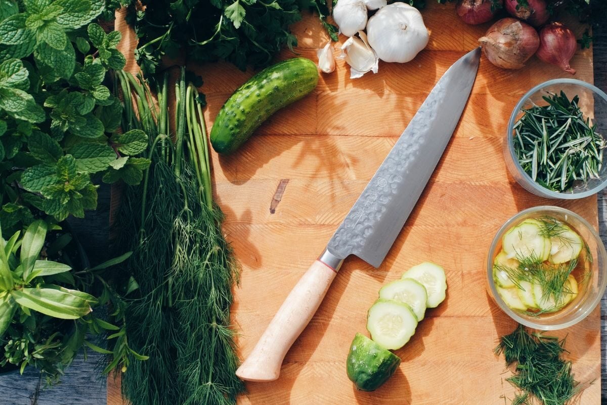 Veggies and Knife on a Wooden Board